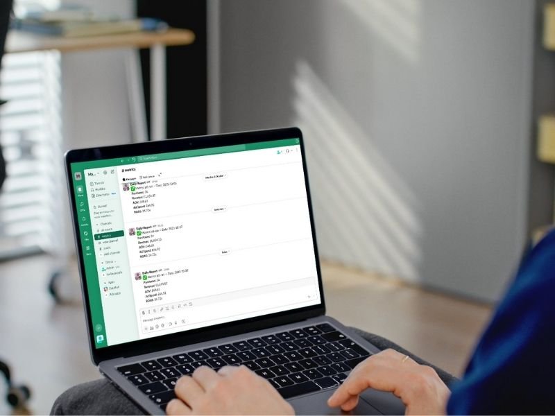 Insight Studio demonstration of daily scheduled alerts on slack. Slack shown on a laptop screen with someone observing the data | Altomate