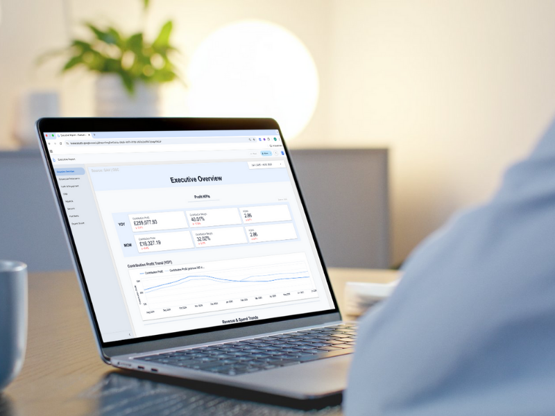Looker Studio Dashboard on a Laptop screen and a worker observing the data | Altomate